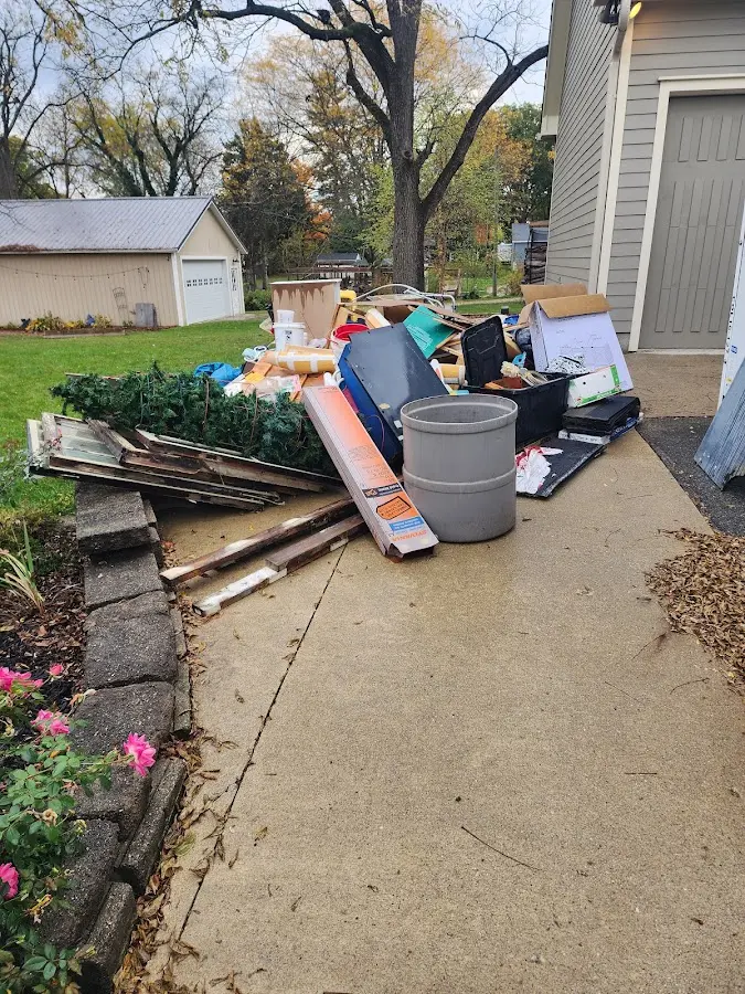 Dumpster being loaded with debris for Residential Dumpster Rental in Conway